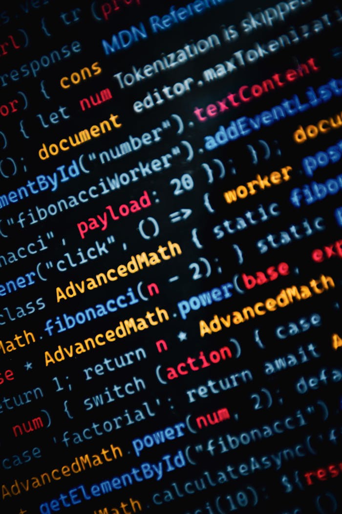about-01 Close-up of vibrant JavaScript code displayed on a monitor showcasing web development.